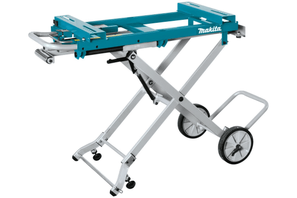 Image displays the Makita DEAWST05, a versatile WST05 Mitre Saw Stand, designed to offer robust support for Makita mitre saws. Constructed from lightweight yet durable materials, it features a compact and foldable design in Makita's professional blue and silver color scheme, facilitating easy transportation and storage. The stand includes extendable support arms to accommodate large workpieces, a tool-less adjustable height mechanism for user convenience, and sturdy rubber wheels for effortless mobility around the job site. Ideal for professionals and DIY enthusiasts seeking a stable, portable platform for precise mitre cutting tasks