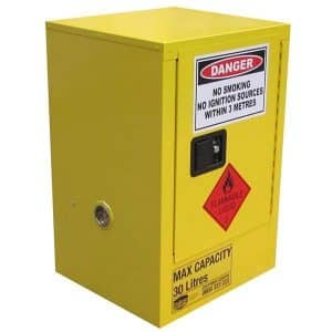 A 30-litre safety storage cabinet designed for holding flammable liquids, painted in vibrant yellow for easy identification. The front of the cabinet features a large warning label indicating 'Flammable Liquids' to caution users. It has a single lockable door with a key visible, ensuring secure storage. The cabinet is equipped with adjustable feet for stability on uneven surfaces and has ventilation holes on the sides to minimize the risk of vapor accumulation. Suitable for use in workshops, laboratories, or industrial environments, this cabinet is essential for safely managing flammable substances.